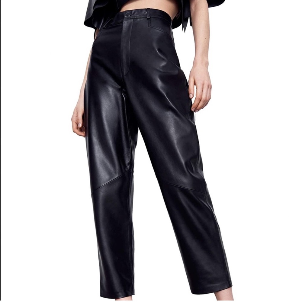 High-waisted black leather pants